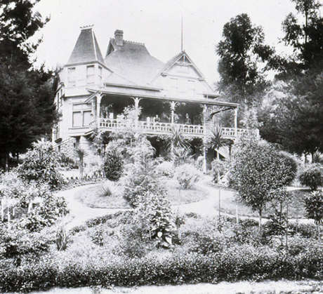 Historic J. Schram Victorian house with formal front gardens, circa 1875