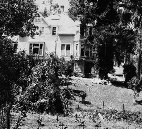 Side view of the J. Schram Victorian house and vegetable gardens, circa 1875