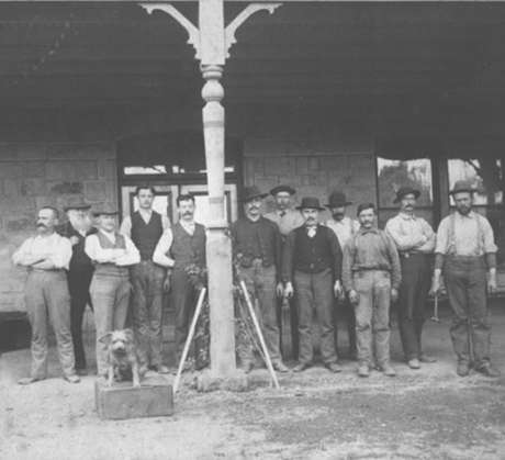 Schramsberg workers and dog gathered under the Victorian house verandah, circa 1881