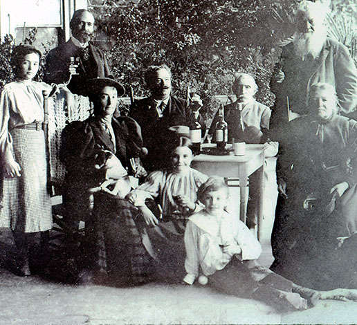 The Jacob Schram family sitting on the veranda of the Schramsberg Victorian house in 1890