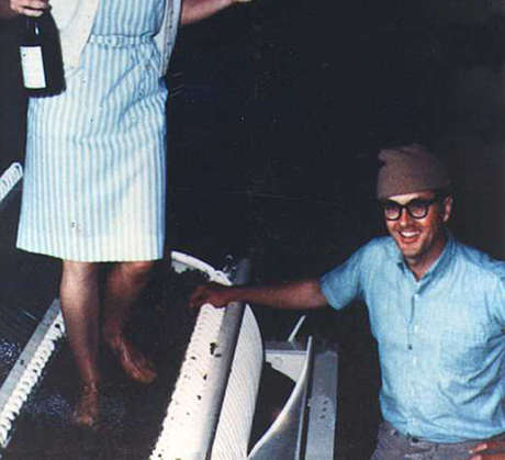 Schramsberg's Jamie Davies crushing grapes with her feet in 1965 with Jack Davies smiling on
