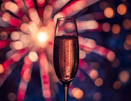 Sparkling wine glass with fireworks
