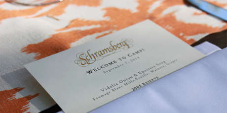 Camp Schramsberg welcome card and dinner menu tucked into a linen napkin