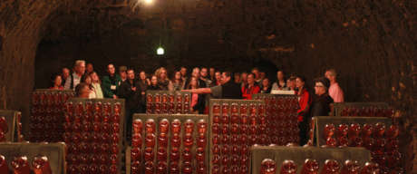 Group from Camp Schramsberg watching a riddling demonstration in the wine caves