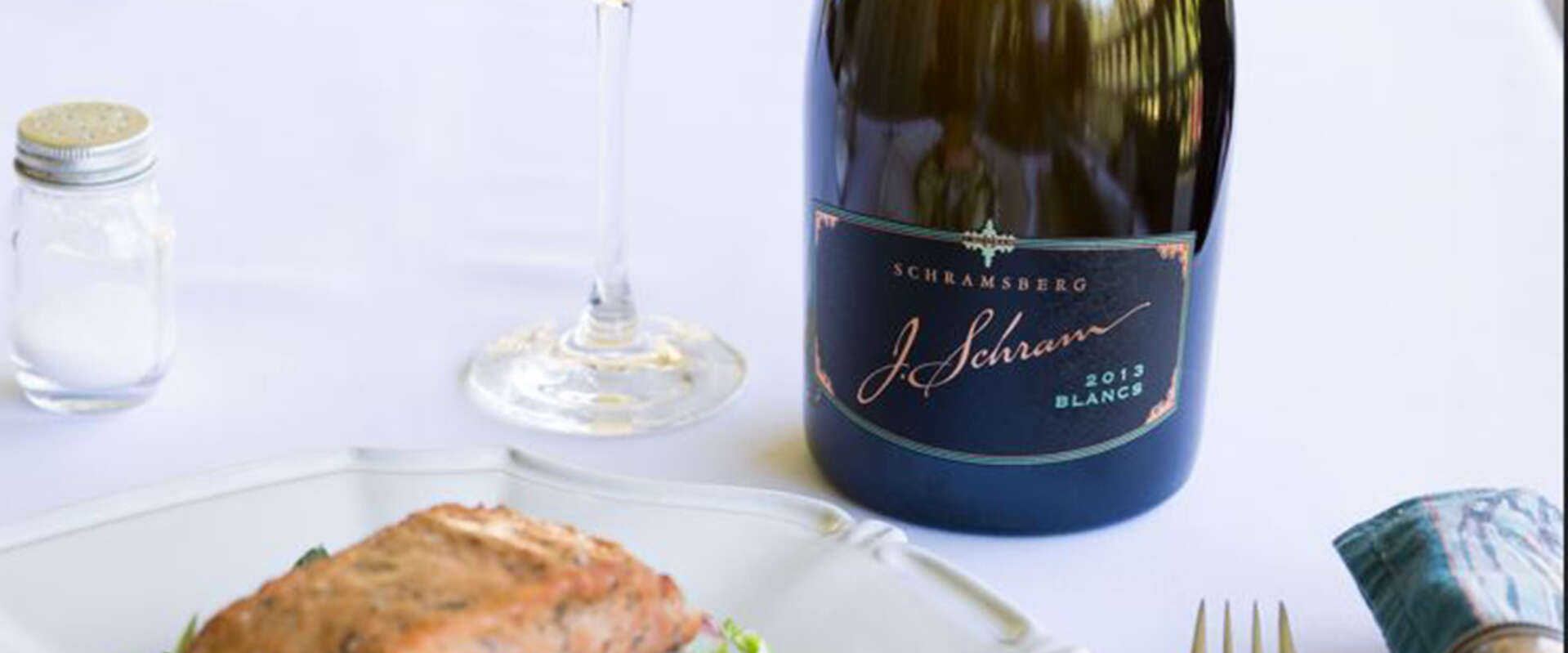J. Schram paired with Bakes Salmon on top a bed of greens