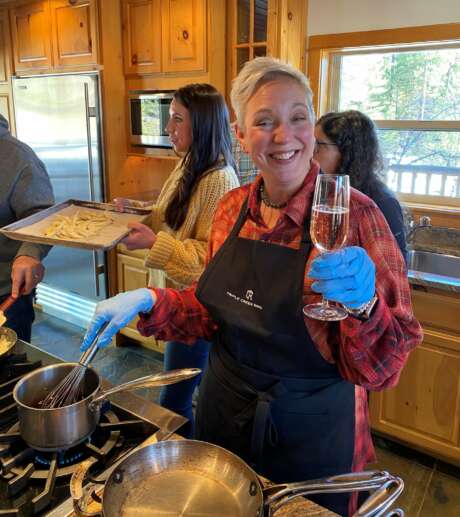 Guest during cooking demo, toasting with Schramsberg Sparkling Wine