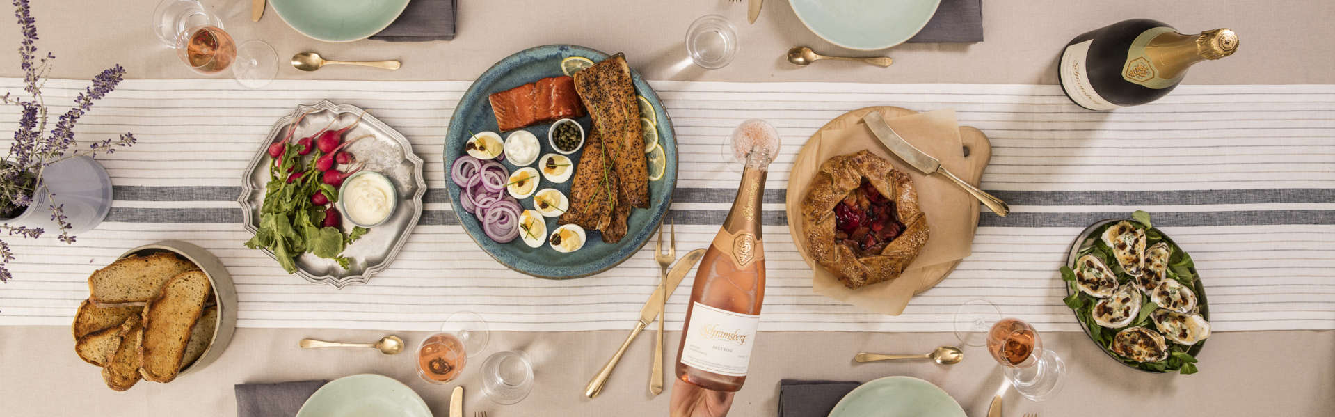 Brut Rosé and Blanc de Blancs paired with oysters, radishes with dip, roast salmon and fruit galette.