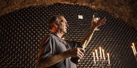 Wine educator with Blanc de Blancs in the wine caves