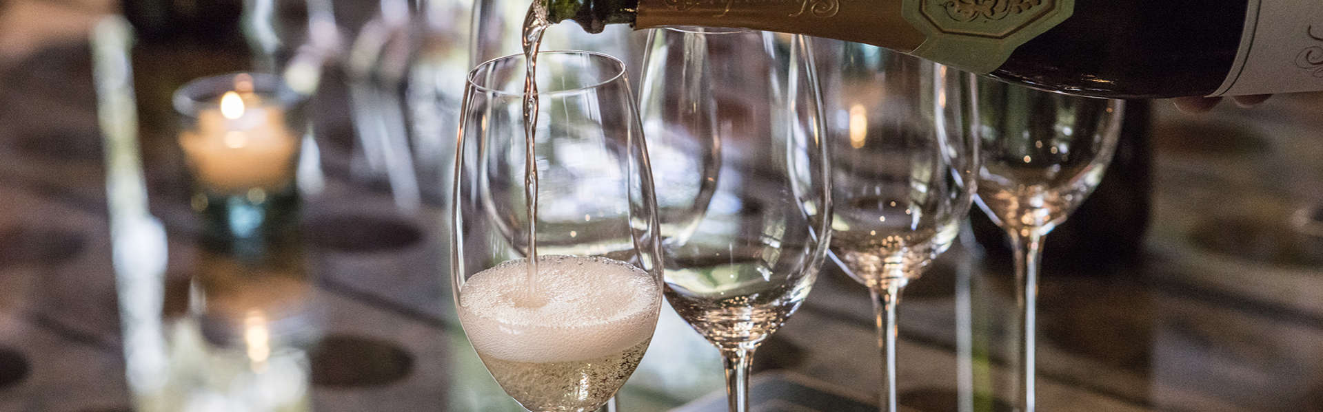 Schramsberg Blanc de Blancs sparkling wine being poured into sparkling wine glasses for a sit down tasting in the visitor's center