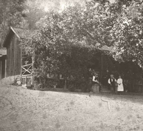 Jacob Schram family members gathered on steps of historic redwood cabin on Schramsberg property, circa 1862
