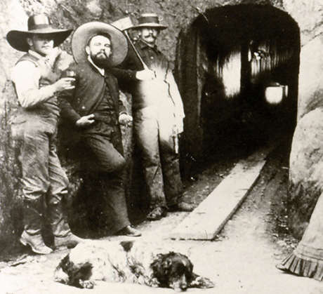 Three cellar workers standing in front of the Schramsberg wine caves entrance, circa 1870